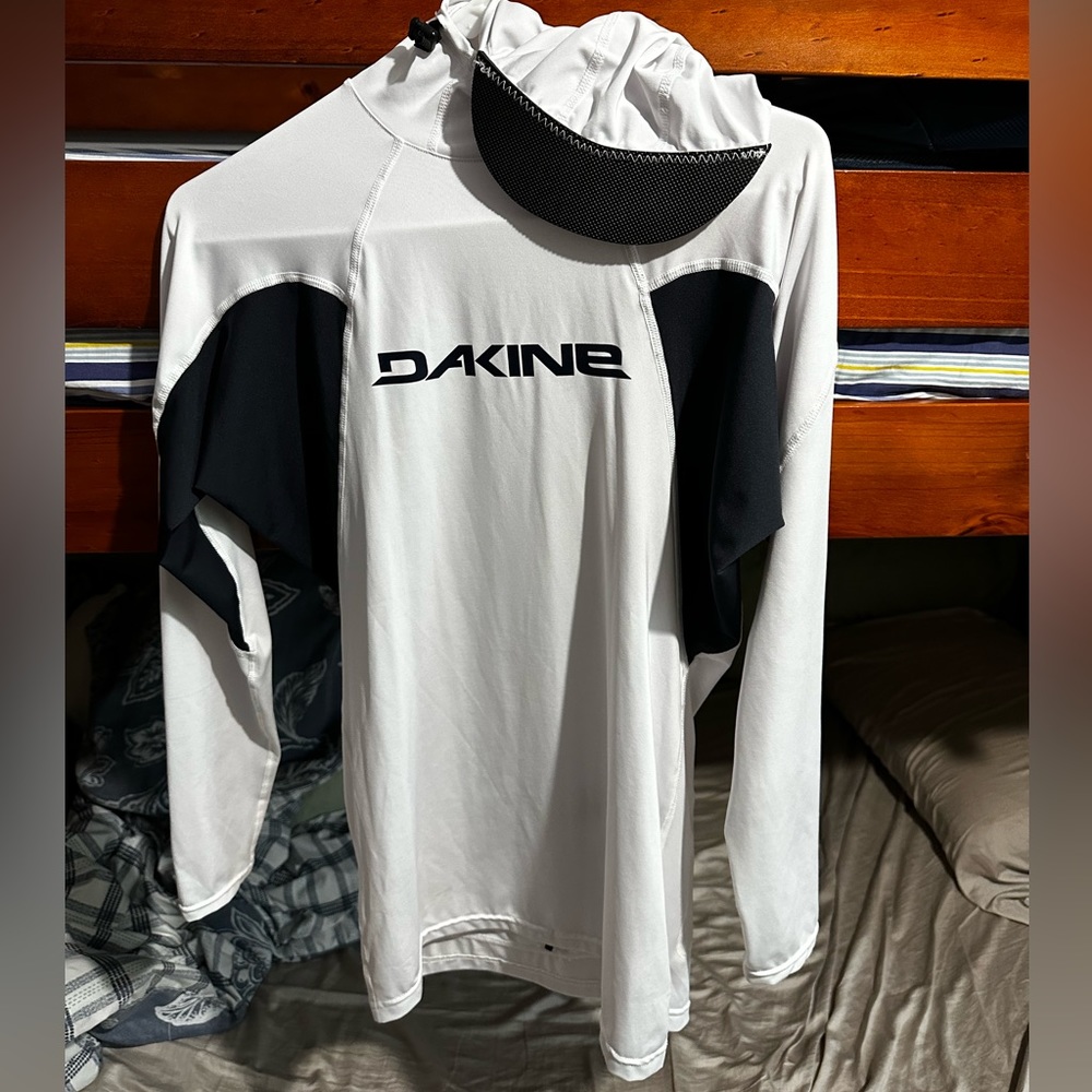 Dakine surfing white wetsuit top with hat
